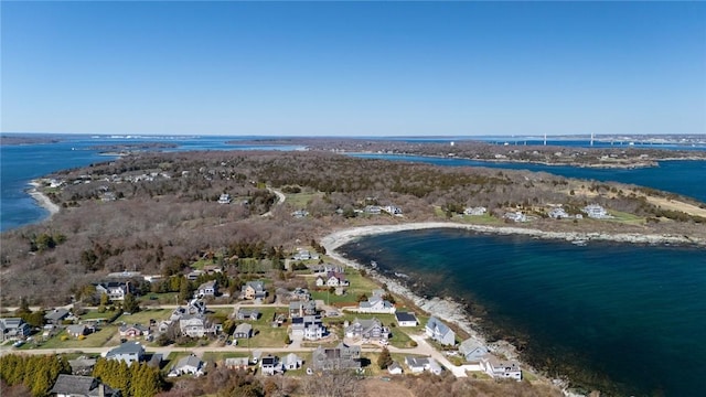 drone / aerial view featuring a residential view and a water view