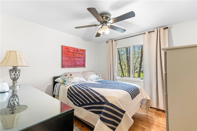 bedroom featuring ceiling fan and wood finished floors