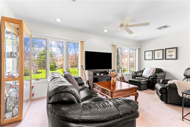 carpeted living area featuring visible vents, ceiling fan, and recessed lighting