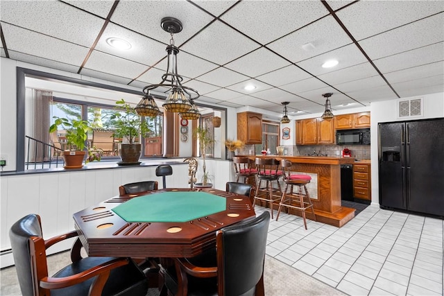 playroom with visible vents and a paneled ceiling