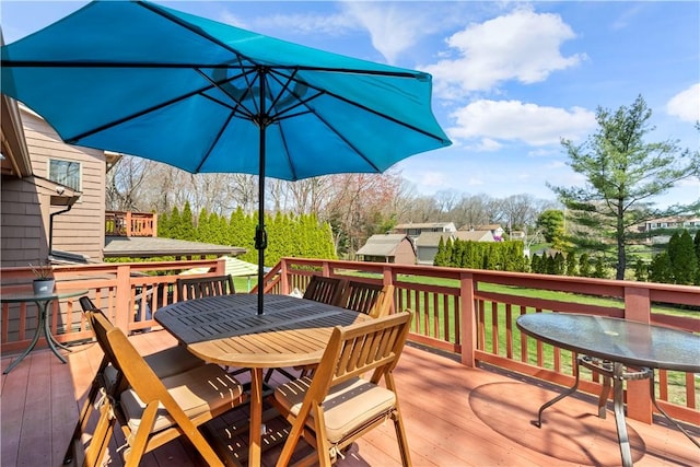 deck with outdoor dining area