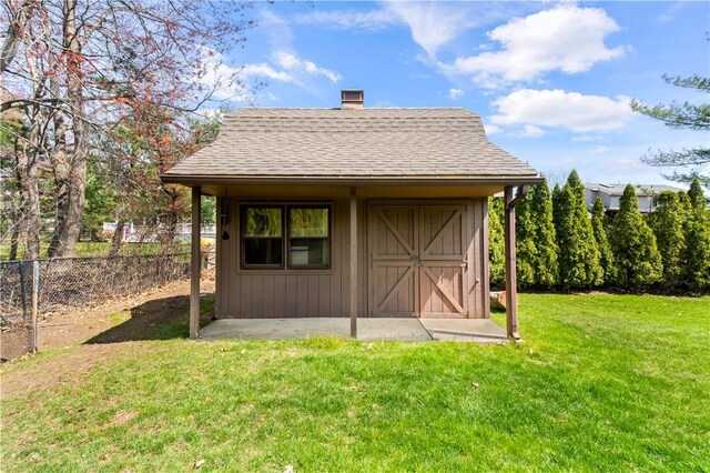 view of shed with fence