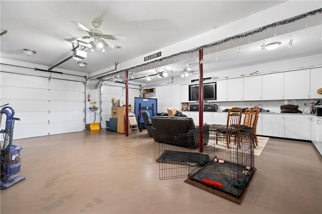 garage featuring a garage door opener and a ceiling fan