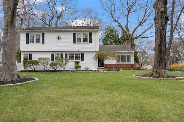 84 Hickory Dr, East Greenwich, RI 02818 - colonial house featuring a chimney and a front lawn