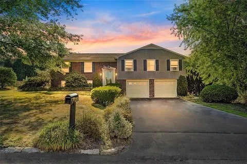 99 Tanglewood Dr, West Warwick, RI 02893 - tri-level home with a garage and driveway