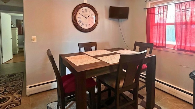 tiled dining room with baseboard heating