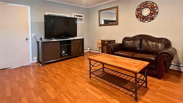 living room featuring light wood-style floors, crown molding, and a baseboard radiator
