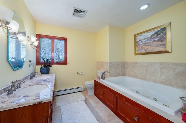 bathroom featuring a whirlpool tub, a sink, baseboard heating, and visible vents