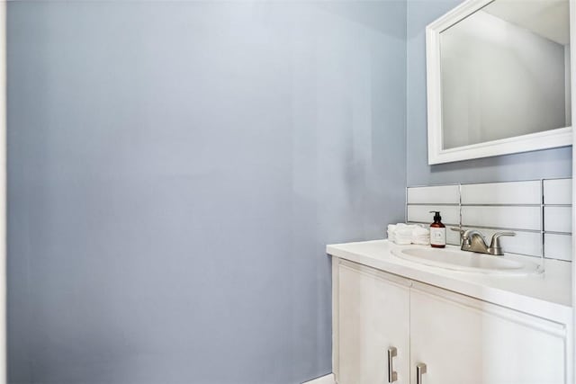 bathroom featuring vanity and baseboards