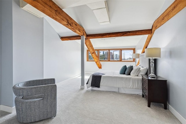carpeted bedroom featuring beam ceiling and baseboards