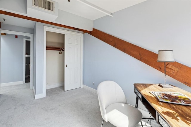 carpeted office space with visible vents and baseboards