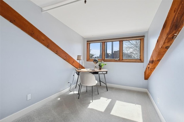 carpeted office space with baseboards