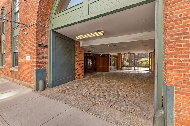 property entrance with brick siding