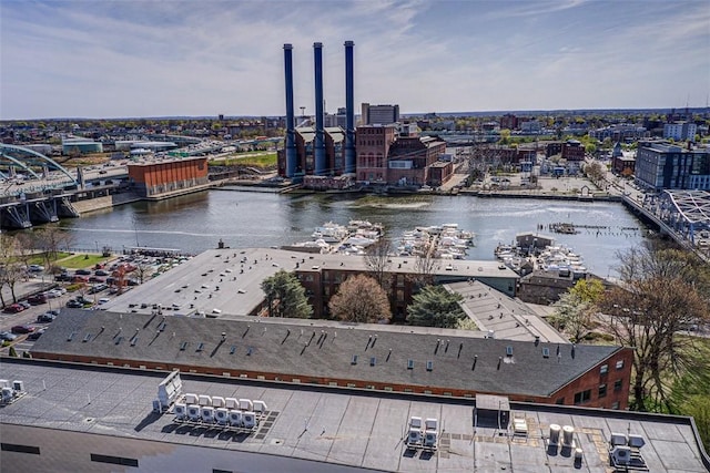 birds eye view of property with a city view and a water view