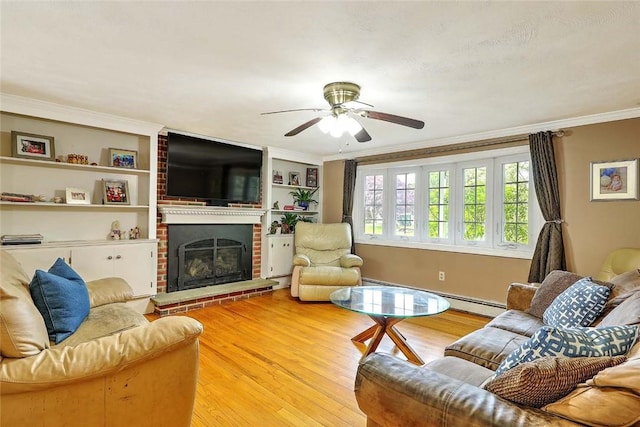 4 Johnson Ct, Bristol, RI 02809 - living area with light wood-style floors, a ceiling fan, ornamental molding, a brick fireplace, and built in shelves