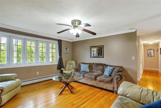 4 Johnson Ct, Bristol, RI 02809 - living room featuring baseboard heating, light wood-type flooring, ornamental molding, ceiling fan, and baseboards