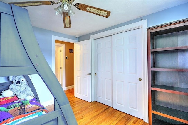 4 Johnson Ct, Bristol, RI 02809 - bedroom with light wood-style floors, a closet, and ceiling fan