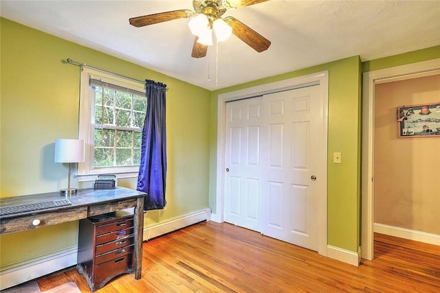 4 Johnson Ct, Bristol, RI 02809 - office featuring a baseboard radiator, baseboard heating, light wood-style floors, baseboards, and ceiling fan