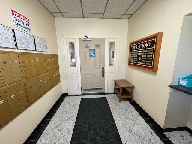 140 High St Unit 108, Westerly, RI 02891 - interior space with tile patterned floors, mail area, and a paneled ceiling