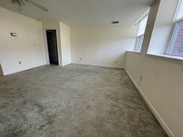 140 High St Unit 108, Westerly, RI 02891 - carpeted spare room with ceiling fan, visible vents, and baseboards