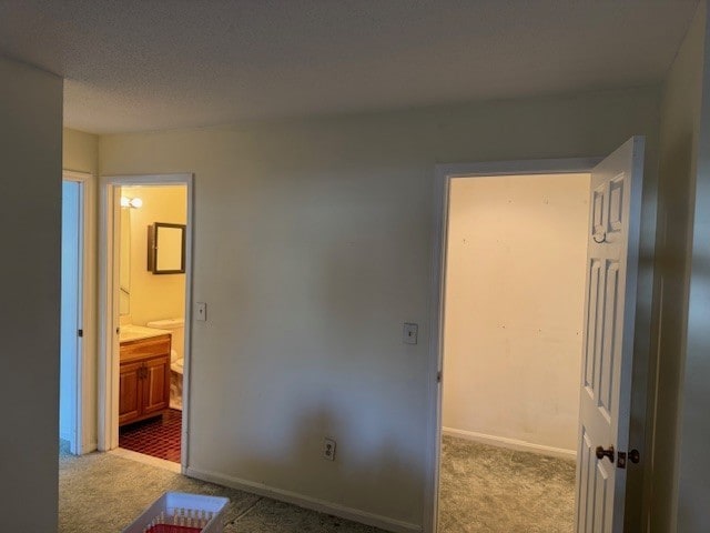 140 High St Unit 108, Westerly, RI 02891 - unfurnished bedroom featuring ensuite bathroom, carpet, and baseboards