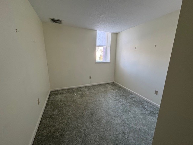 140 High St Unit 108, Westerly, RI 02891 - empty room with carpet, visible vents, a textured ceiling, and baseboards