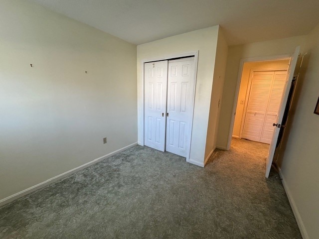 140 High St Unit 108, Westerly, RI 02891 - unfurnished bedroom with a closet, carpet, and baseboards