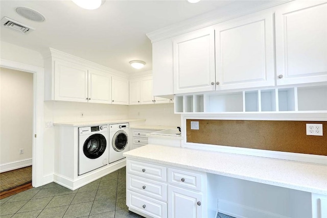 750 Elmgrove Ave, Providence, RI 02906 - washroom with visible vents, washing machine and dryer, baseboards, tile patterned floors, and cabinet space