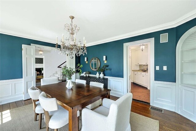 750 Elmgrove Ave, Providence, RI 02906 - dining room with visible vents, dark wood-style floors, and a decorative wall