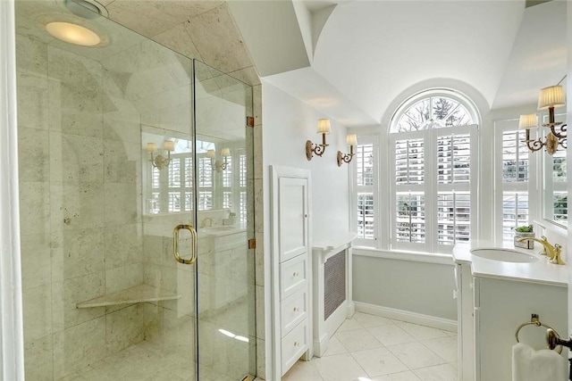 750 Elmgrove Ave, Providence, RI 02906 - full bath featuring vanity, tile patterned floors, baseboards, a shower stall, and lofted ceiling