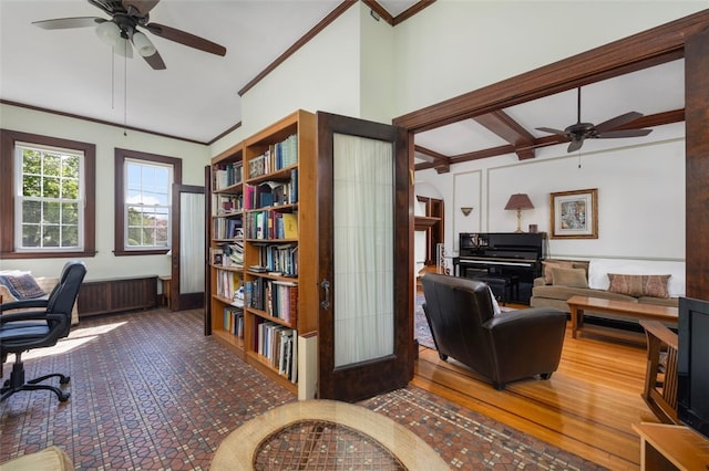 office with ceiling fan, crown molding, and lofted ceiling
