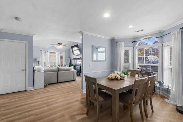 dining space with recessed lighting, light wood-style flooring, ceiling fan, baseboards, and crown molding