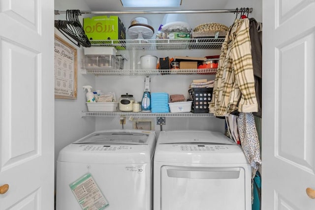 washroom featuring washer and dryer and laundry area