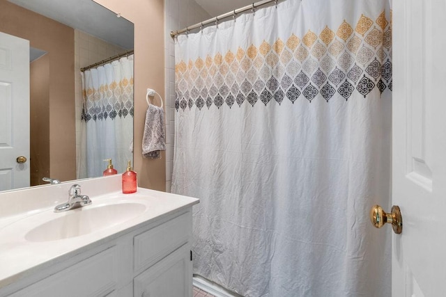 bathroom featuring vanity and a shower with shower curtain
