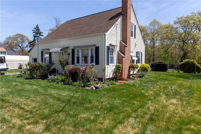 132 Bakers Creek Rd, Warwick, RI 02886 - view of property exterior with a yard, a chimney, and a shingled roof