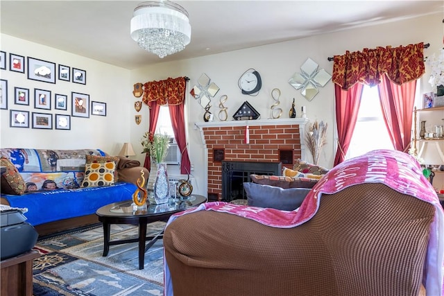 132 Bakers Creek Rd, Warwick, RI 02886 - living area featuring a fireplace, a chandelier, and a wealth of natural light