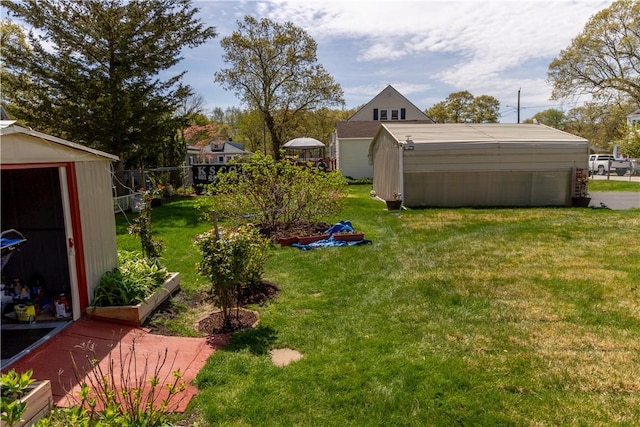 132 Bakers Creek Rd, Warwick, RI 02886 - view of yard featuring fence, an outdoor structure, and a shed