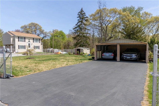 132 Bakers Creek Rd, Warwick, RI 02886 - view of vehicle parking featuring fence, a shed, and a detached carport