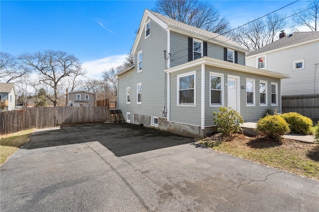 exterior space featuring fence and driveway