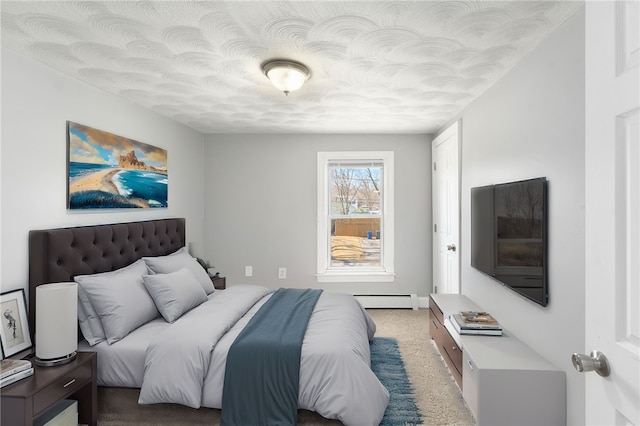 bedroom featuring light carpet, a textured ceiling, and a baseboard radiator