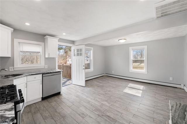 kitchen with a sink, visible vents, a wealth of natural light, and stainless steel appliances