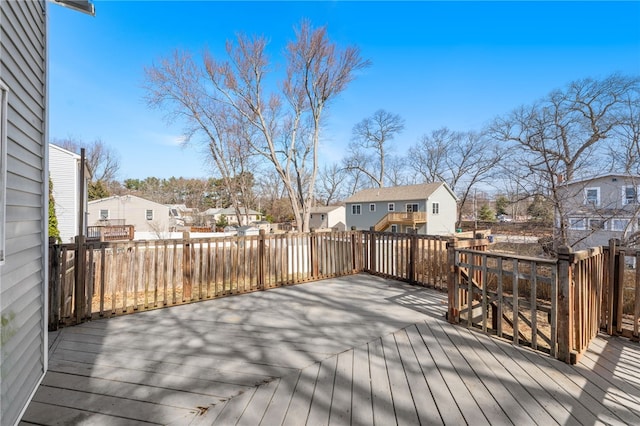 wooden deck featuring a residential view