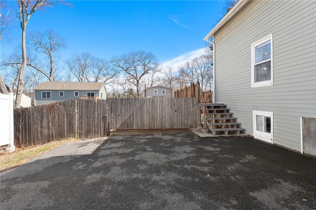 exterior space featuring fence and stairs