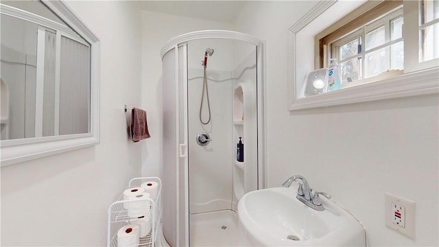 full bathroom with a sink and a stall shower