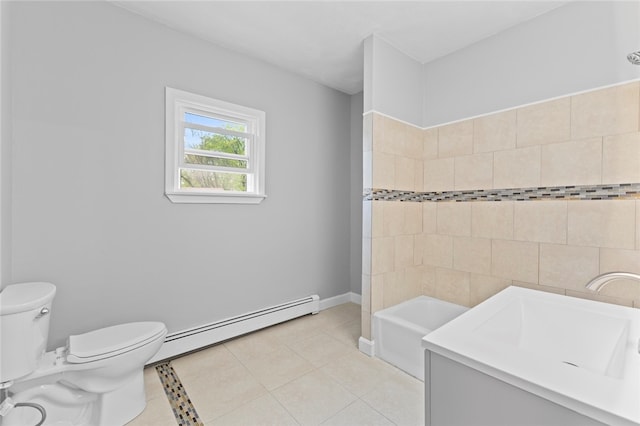 bathroom with toilet, a tub, tile patterned floors, and a baseboard radiator