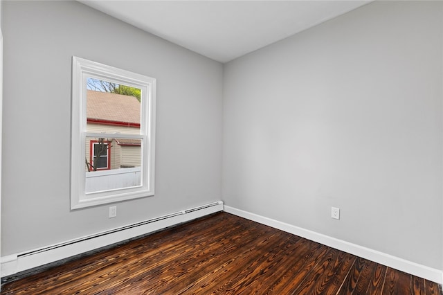 unfurnished room featuring baseboard heating, baseboards, and dark wood-style flooring