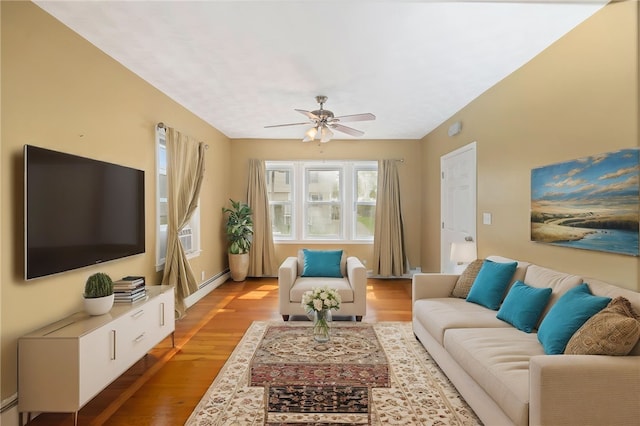living room with a ceiling fan and light wood-style floors