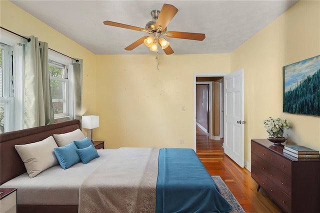 bedroom with wood finished floors and ceiling fan