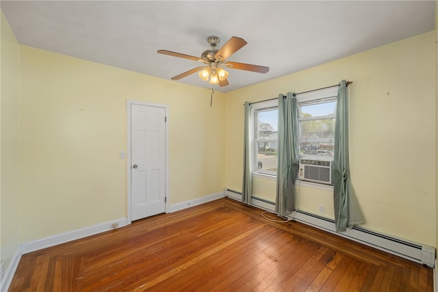 unfurnished room featuring wood-type flooring, cooling unit, a ceiling fan, baseboards, and a baseboard radiator