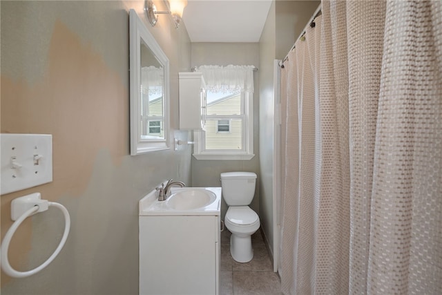 bathroom featuring tile patterned floors, toilet, a shower with curtain, and vanity